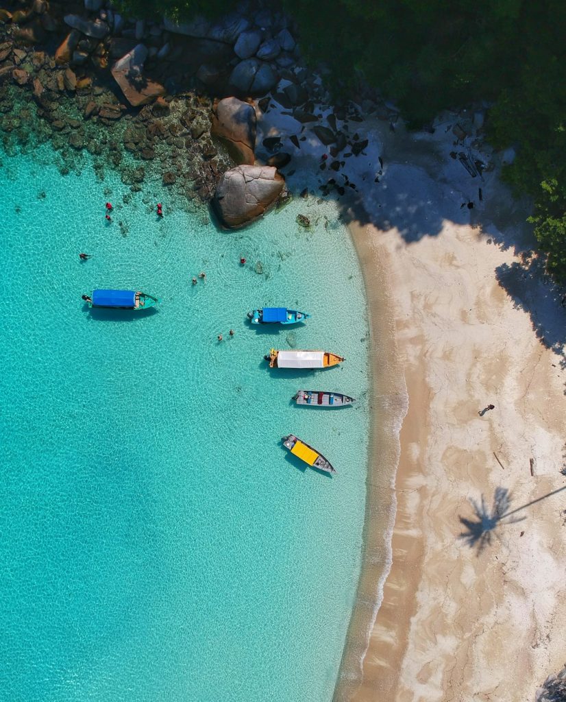 aerial-view-photography-of-boats-on-seashore-2ueunl4ckv8